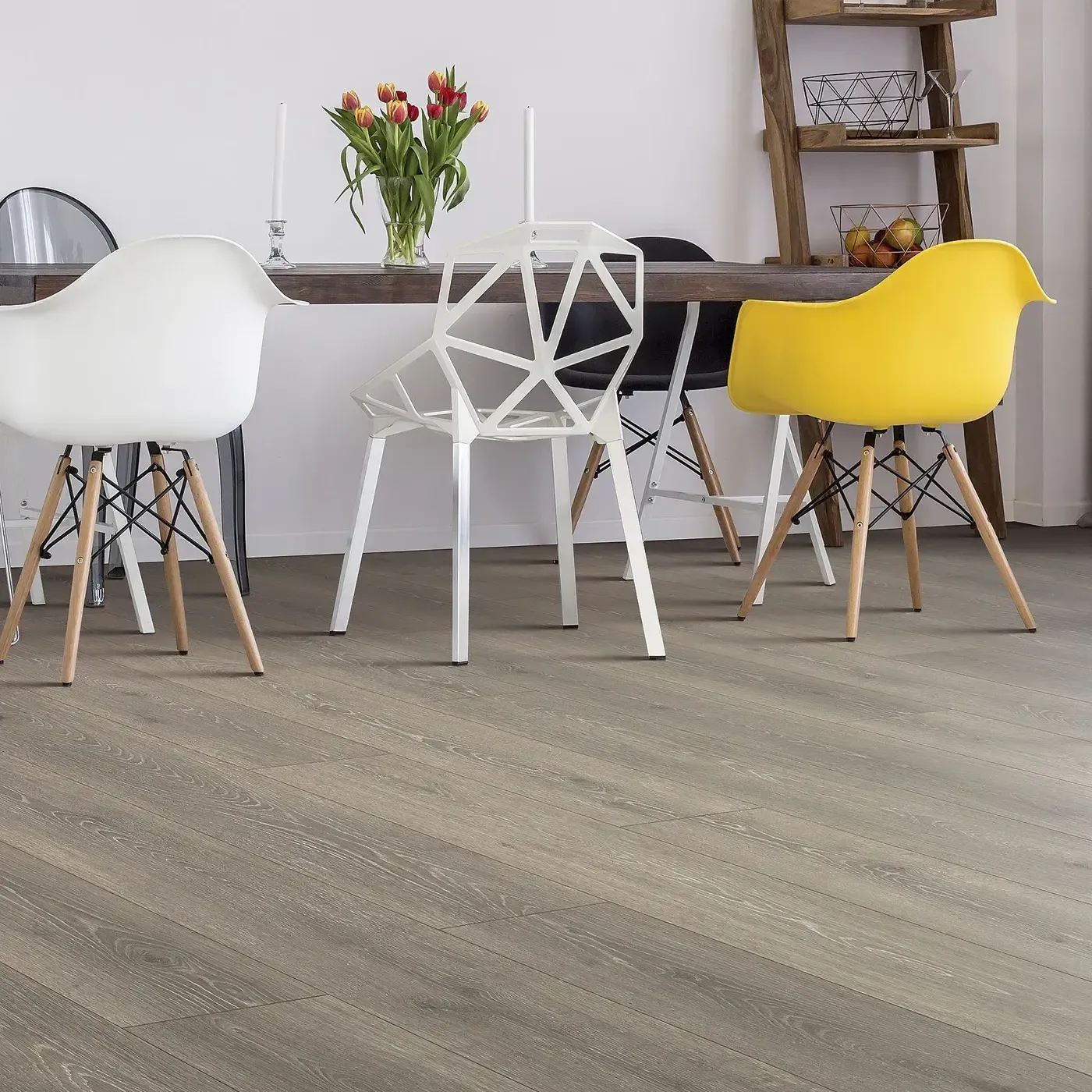 Laminate in a gray-brown wood tone in a modern dining room | Fantastic Floors